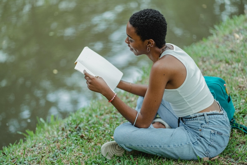 woman reading in the grass