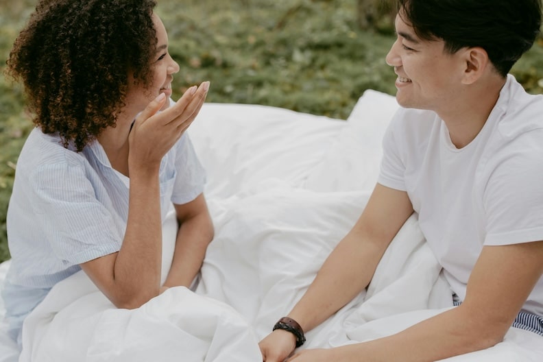 therapy for relationship anxiety. couple speaking under blanket